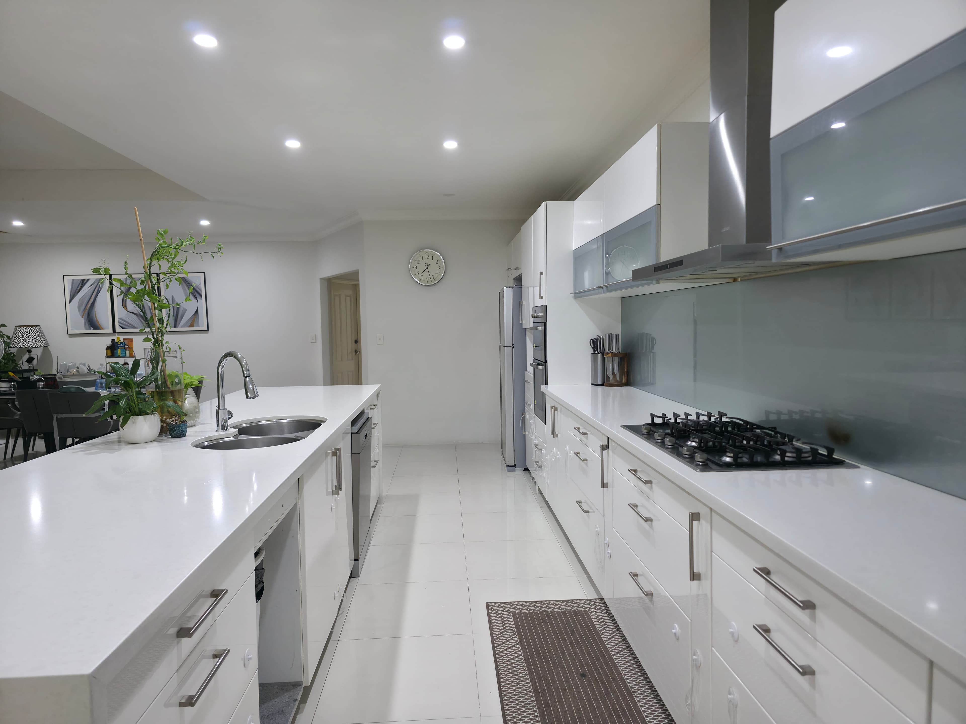 Luxury white kitchen with island and sink
