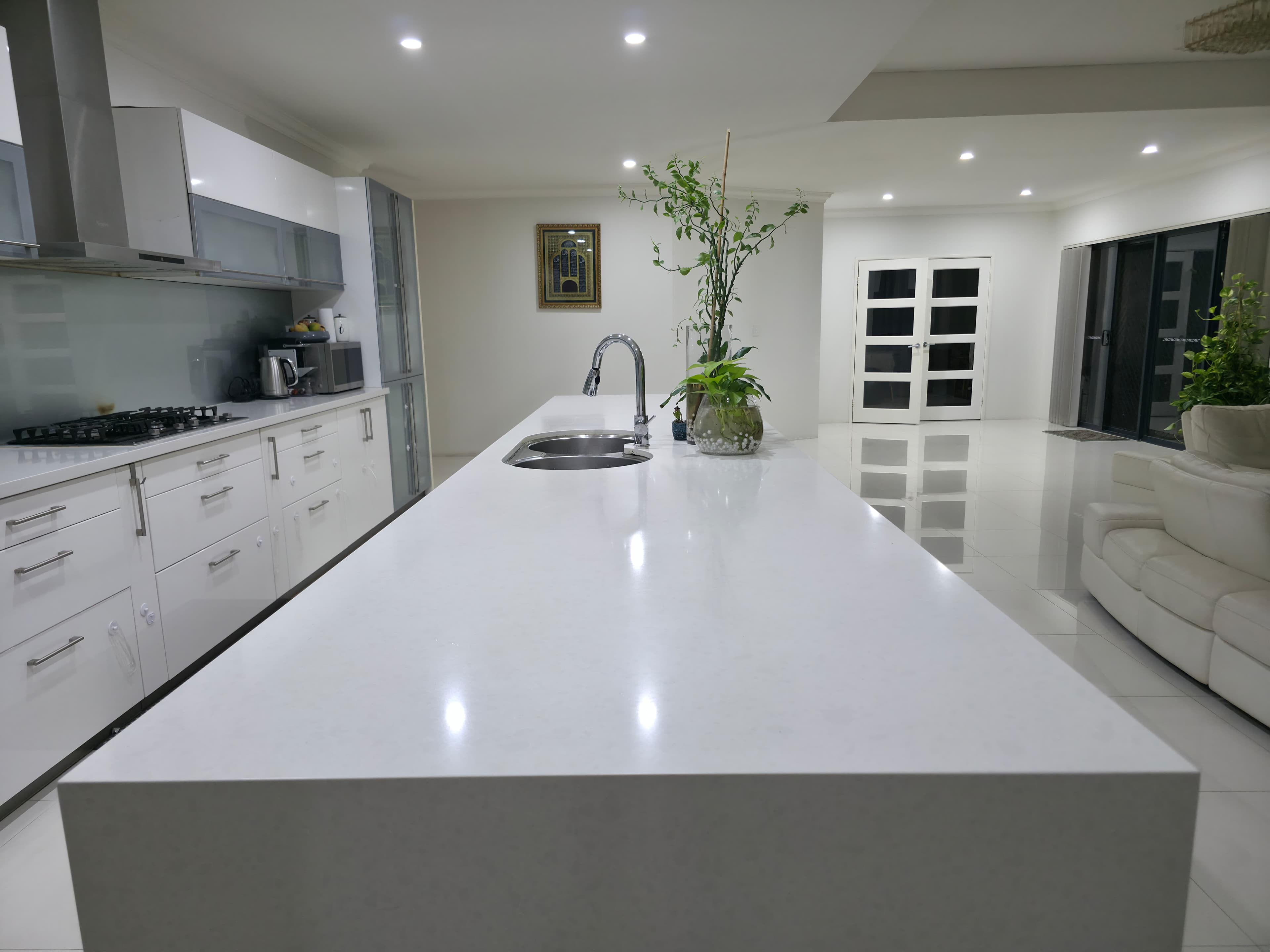 Kitchen with black marble accents and timber joinery