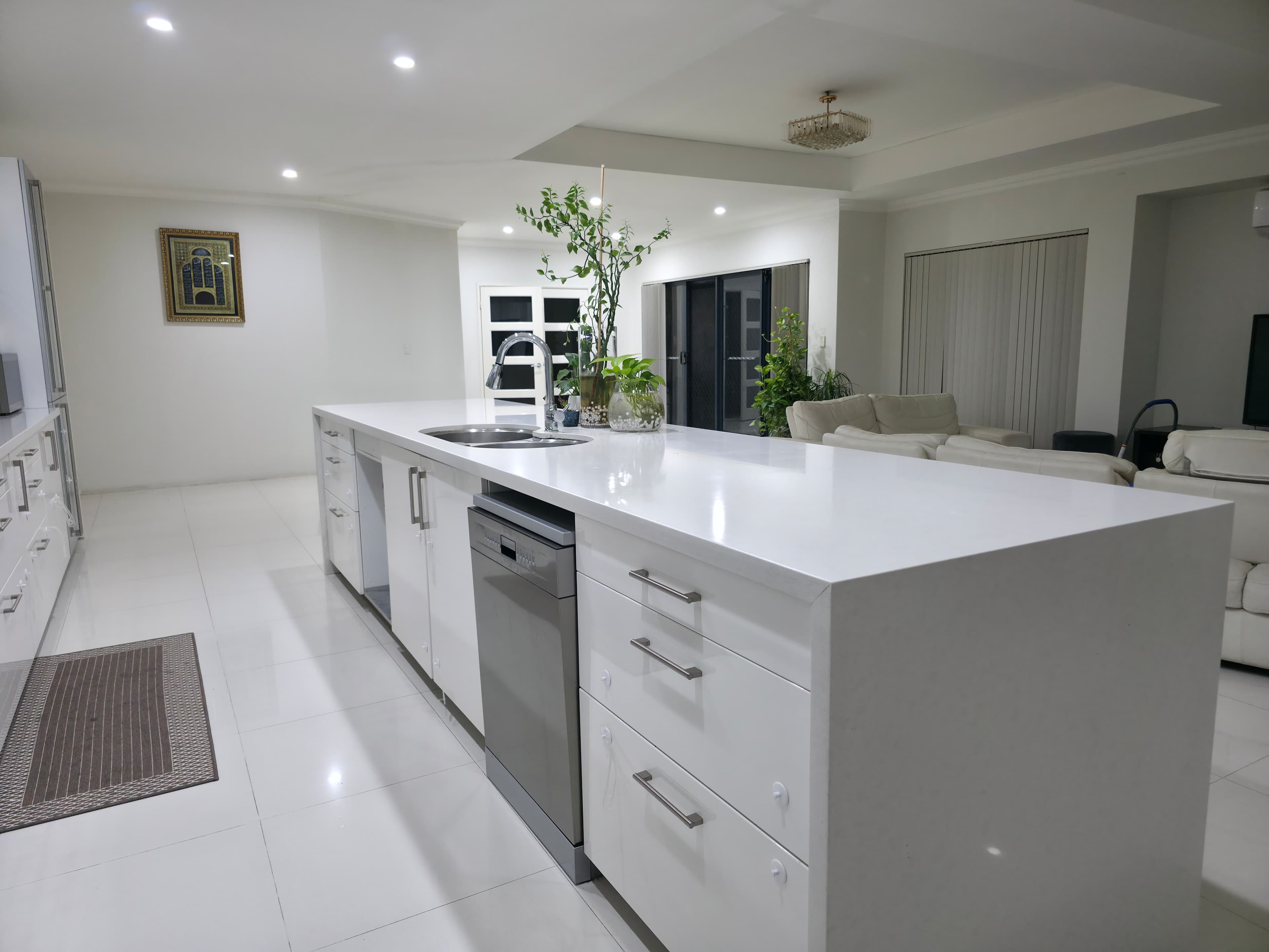 Compact kitchen with black marble benchtops